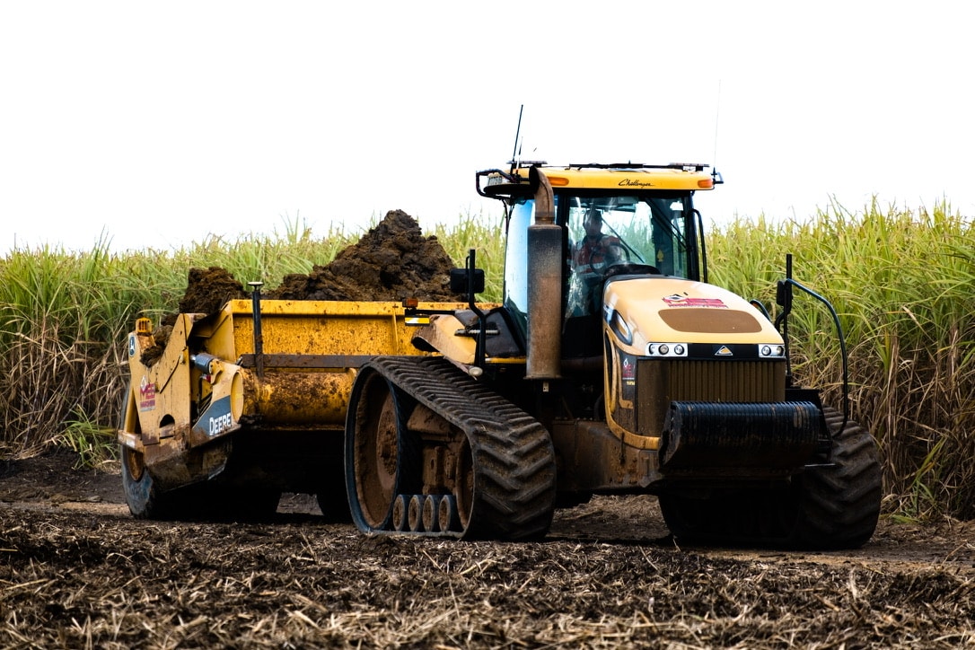 Farm tractor hauling soil